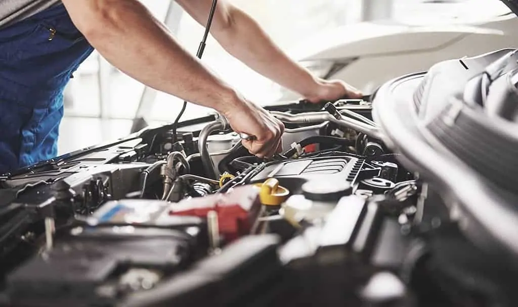 Our Mechanic Performing a Tune-Up on a Customer's Vehicle