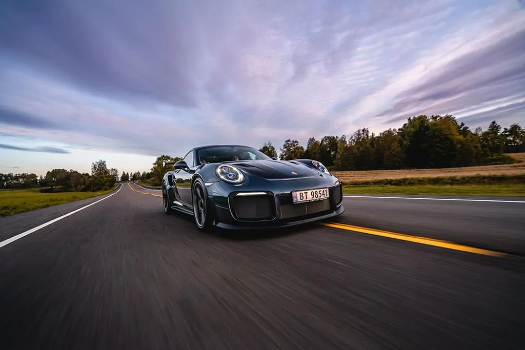 Porsche being test-driven on a closed track.