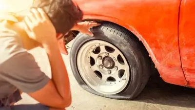 Customer stuck on the side of the road with a flat tire in Mays Landing