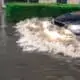 Car driving through flood waters in Margate, NJ