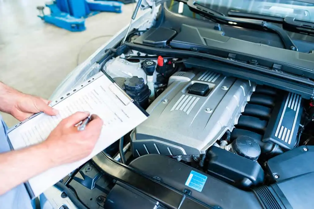 Mechanic reviewing customer vehicle in Mays Landing